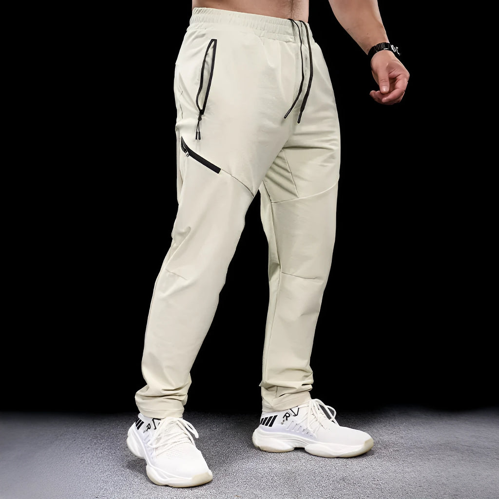 Men's waterproof quick-dry workout trousers in nylon fabric for sports and fitness