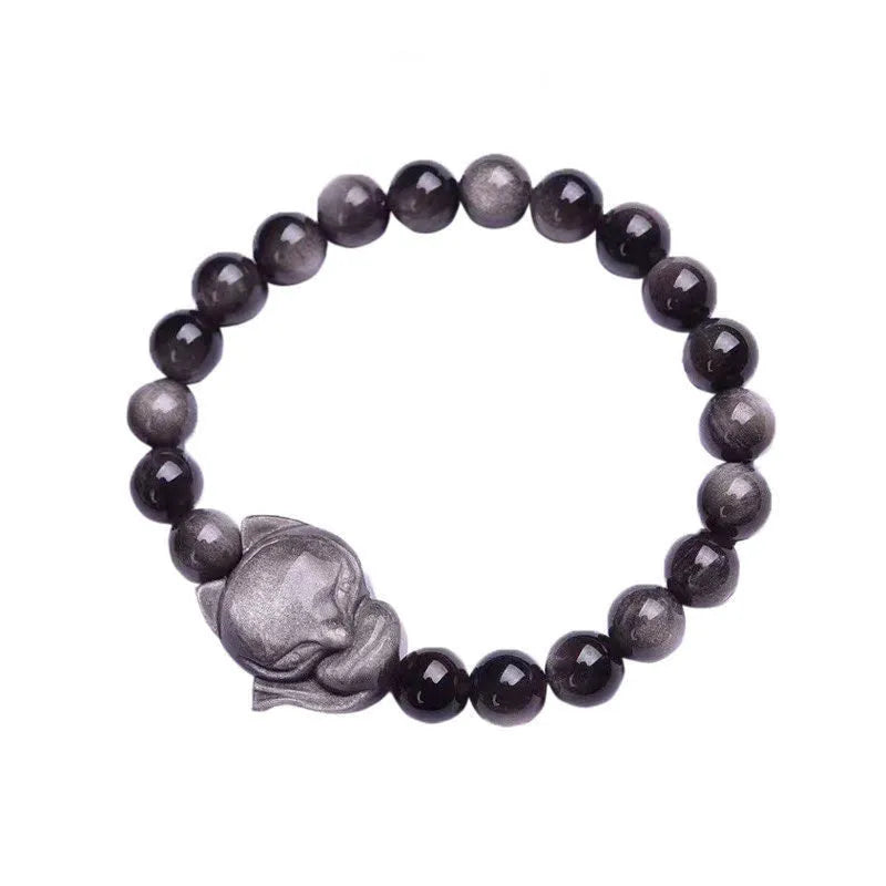 Adjustable obsidian bracelet with a single polished 8mm bead carved with a fox design.