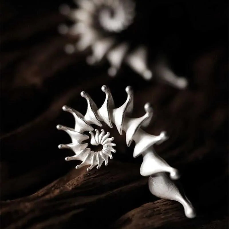 Exaggerated conch-shaped three-dimensional matte alloy stud earrings with electroplated finish