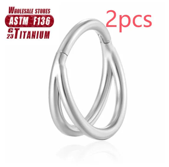 Close-up of a titanium alloy fork nose ring in silver, showing the two-prong design on a grey background.