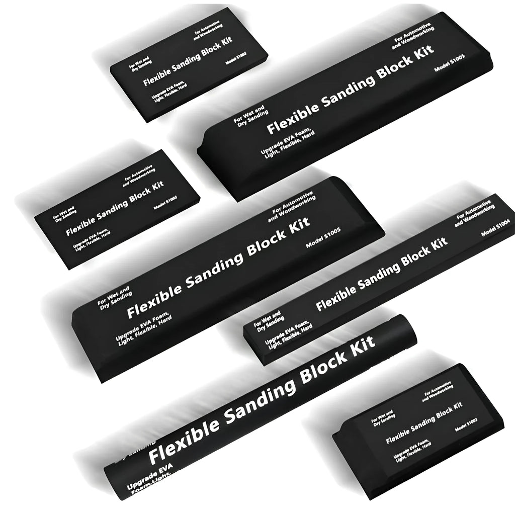 Set of seven identical black frosted metal building blocks for model making