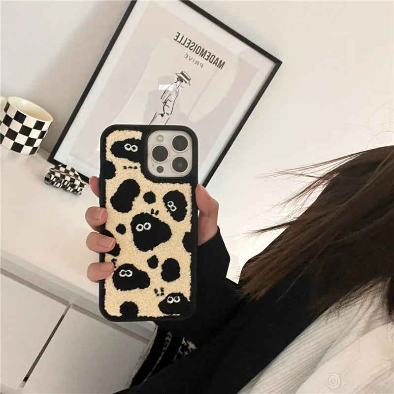 Black plush soft back phone case featuring a fairy character design for compatible iPhone models.