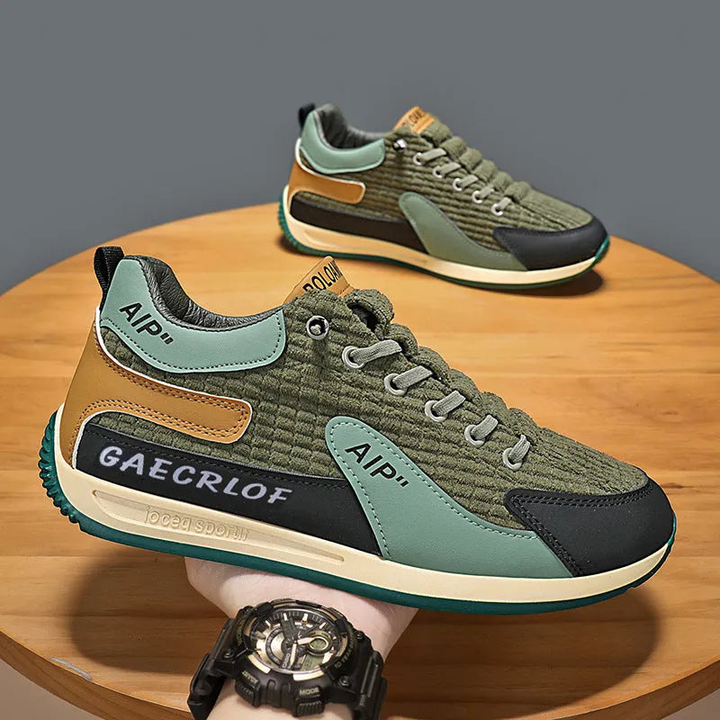 Men's lightweight mesh running shoe in green or grey with lace-up front and round toe