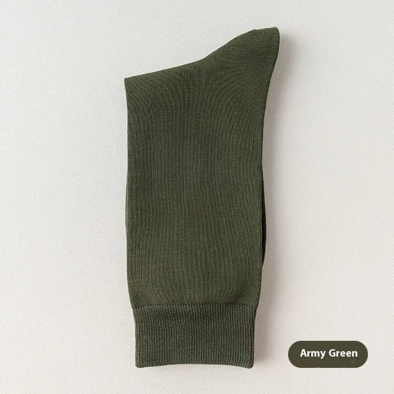 Mid-calf men's socks in solid colours made from combed cotton, shown in a stack.