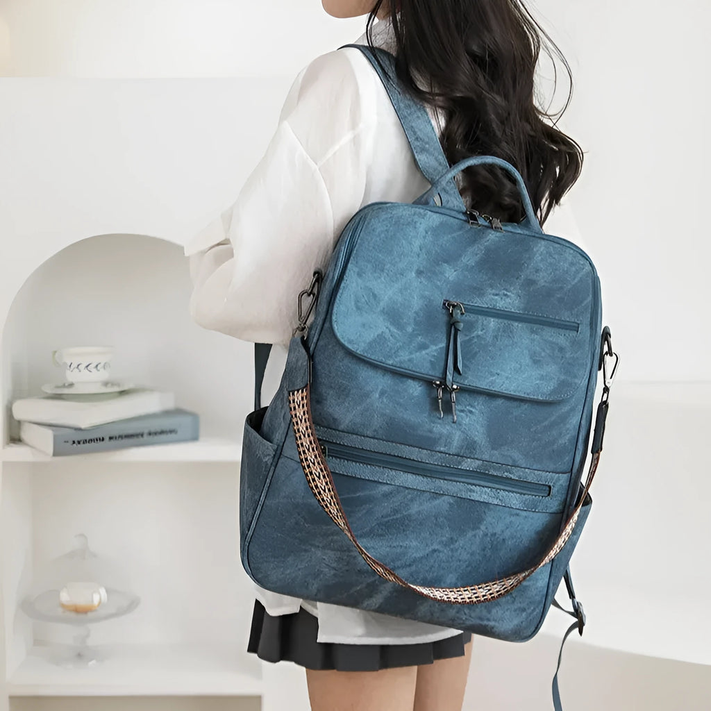 Retro college backpack with curved shoulder straps in multiple colour options including black, blue, grey, and coffee tones