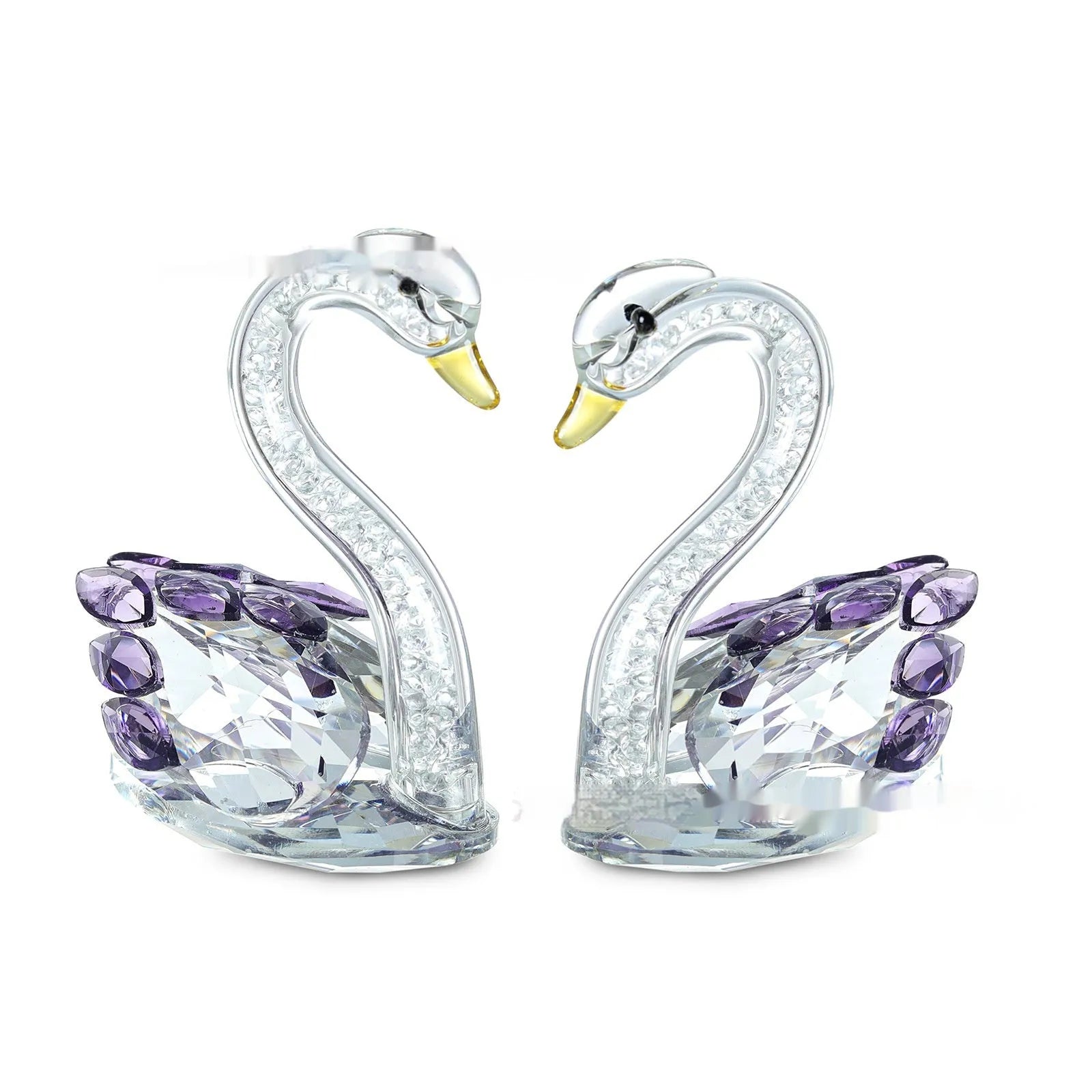 White crystal swan decoration on desktop with red, blue, pink, and violet colour options
