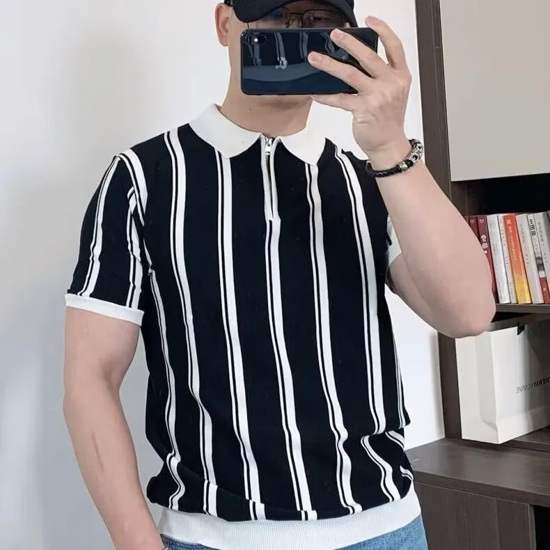 Man wearing a black Korean-style casual T-shirt with vintage stripes, cartoon graphics, and a decorative zipper detail.