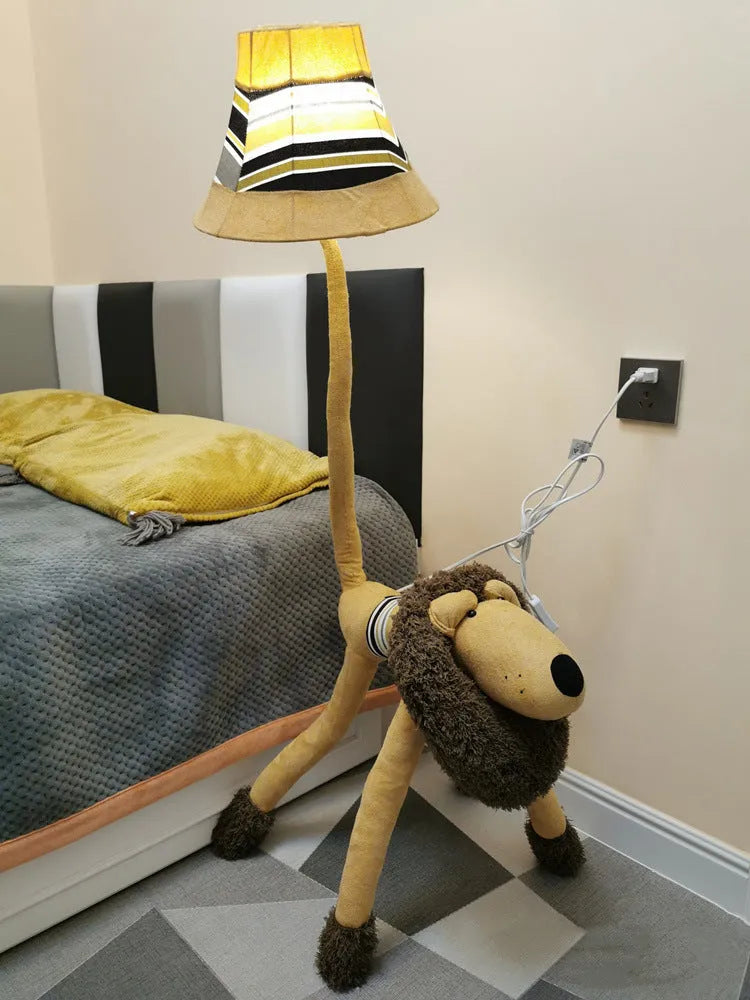 Hand-knitted cloth children's cartoon floor lamp with Christmas deer or lion design in a bedroom setting