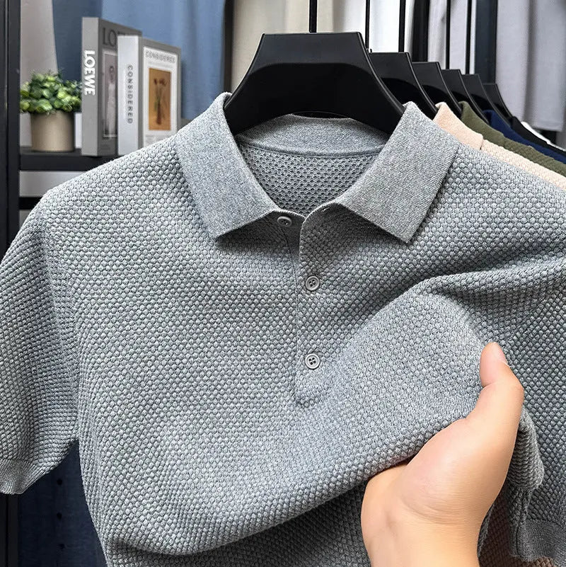Loose fit pure cotton short sleeve pullover sweater in grey on a hanger.