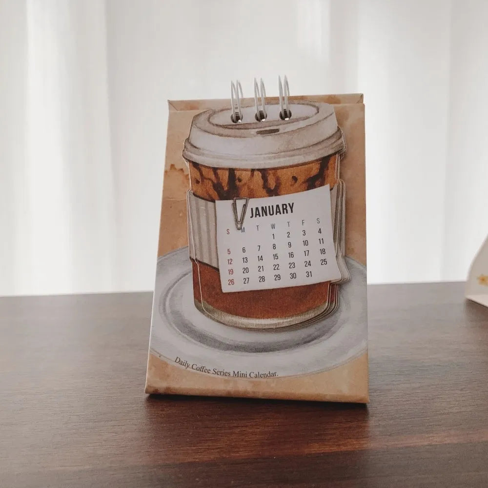 Mini A5 desk calendar 2025 showing one of eight themed designs in simple modern style