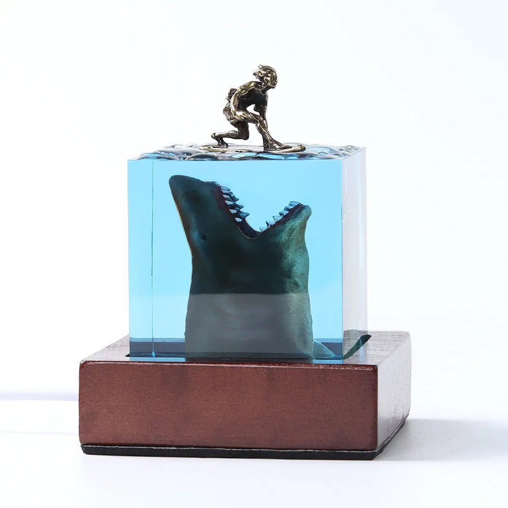 Epoxy resin shark surfer night light ornament on a desk, showing 5cm and 8cm size options.
