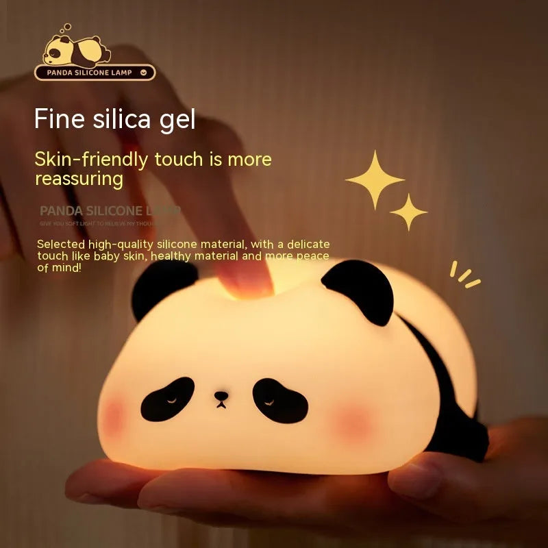Cartoon panda-shaped night light with soft silicone construction and warm white LED glow