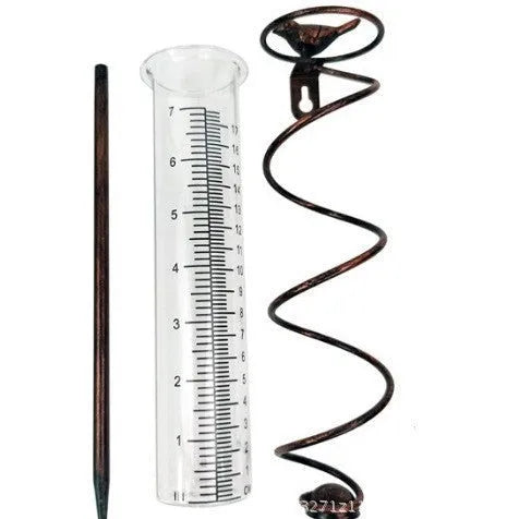 Cast iron bird rain gauge with glass measurement tube showing 1-20 scale for garden rainfall monitoring