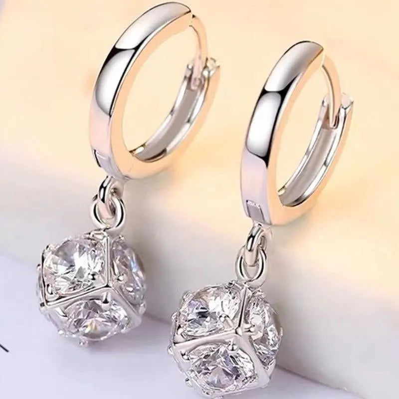 Geometric rose zircon earrings for women in copper with electroplated finish, shown in one of 11 available style variations.