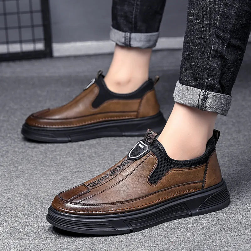 Men's black and brown solid colour leather casual shoes with round toe.