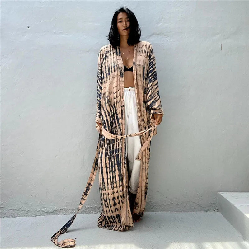 Loose-fitting cotton beach cover-up blouse in a printed pattern, shown in a rust red colour.