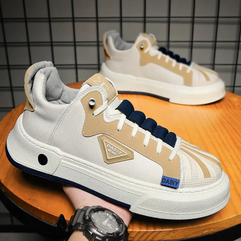 Men's beige low-top casual sneakers with elastic band and round toe, showing leather stitching detail.