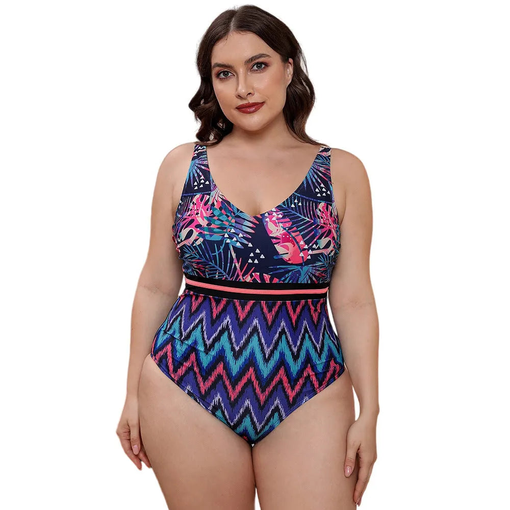 Blue and white printed one-piece swimsuit for women with spaghetti straps, shown on a mannequin.