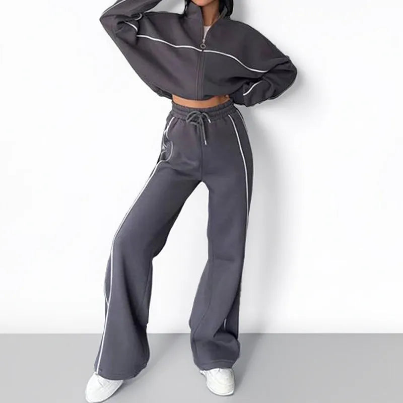 Casual polyester suit set showing a mock neck zip hoodie and matching striped trousers with lace-up detail.