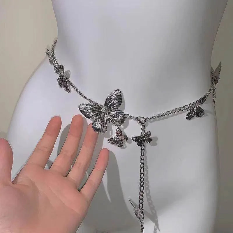 Gold and silver alloy waist chain with butterfly ornament, showing 104cm length.