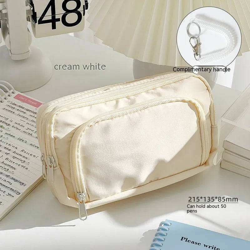 Double layer pencil case in blue, pink, cream, or green with gift handle, dimensions 215x135x85mm