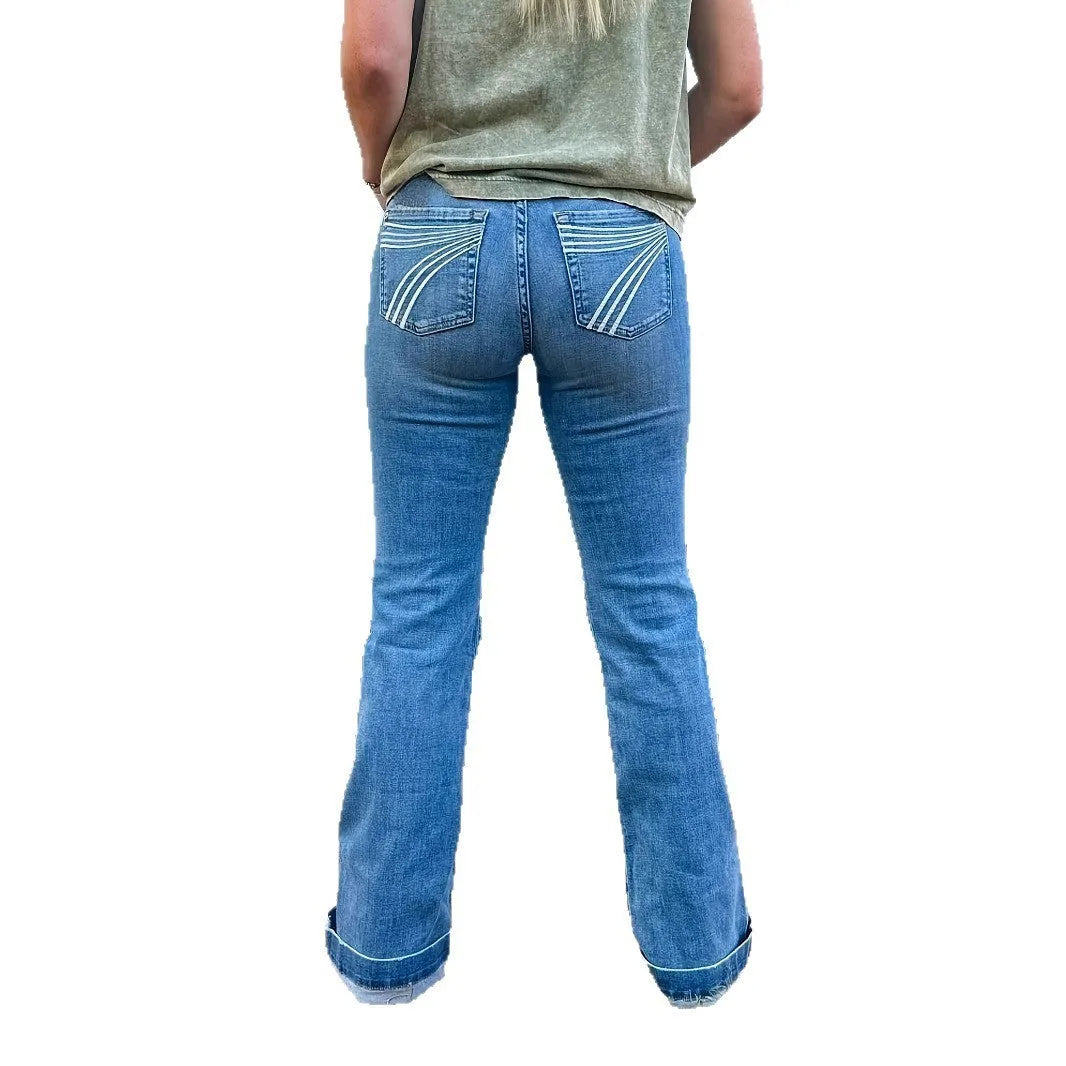 Slim fit blue embroidery jeans with elastic denim and a slight flared leg on a mid-waist.