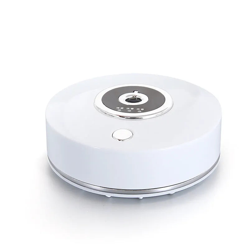 USB-powered plastic car air freshener holder in black, grey, or white colour with charging cable.