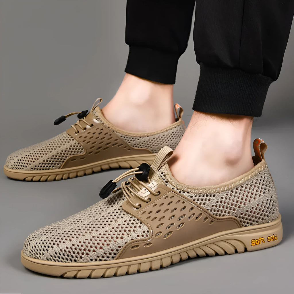 Men's black breathable mesh casual shoes with elastic band fastening and flat rubber sole