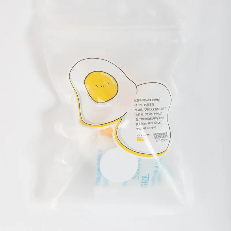 Organic catnip ball toy in fried egg and poached egg designs with wall mount capability