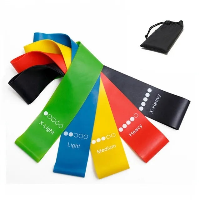 Five colour-coded TPE yoga tension straps with graduated thickness for resistance training