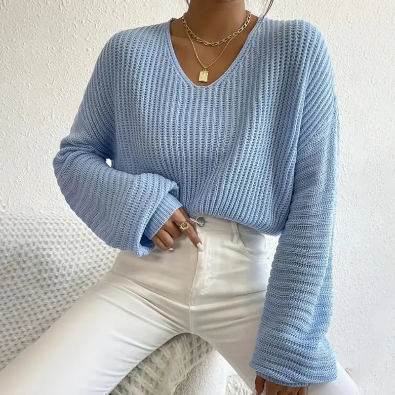 Women's solid colour long sleeve pullover top in polyester, shown in available colours.