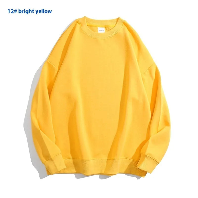 A loose round neck off shoulder pullover sweater in a solid colour, with long sleeves.