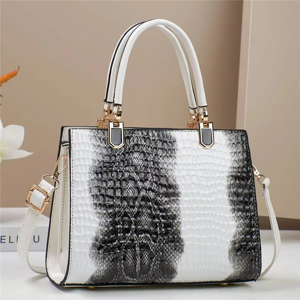 Soft PU leather one shoulder handbag in a horizontal square shape with internal organiser pockets.