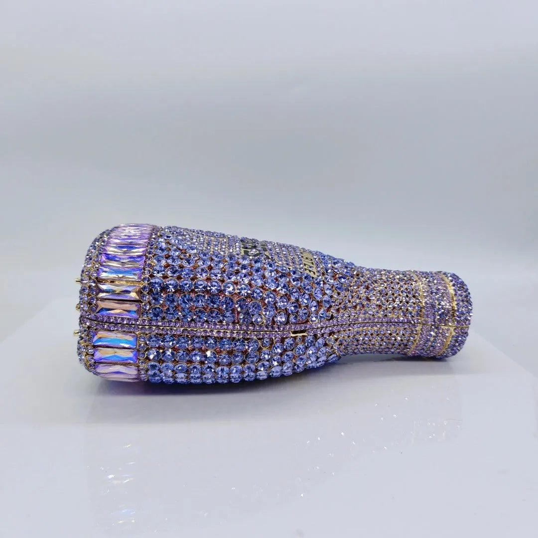 Champagne bottle shaped evening clutch with rhinestone details and metallic finish