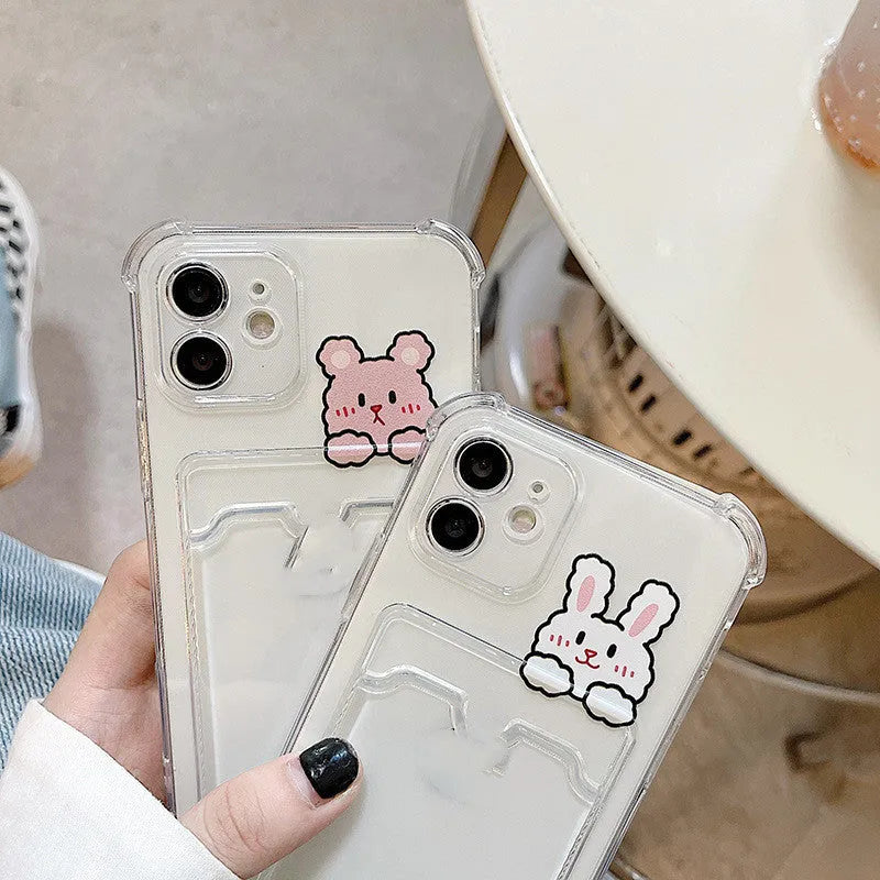 Clear cartoon design iPhone case with a card slot on the back, shown on a phone.