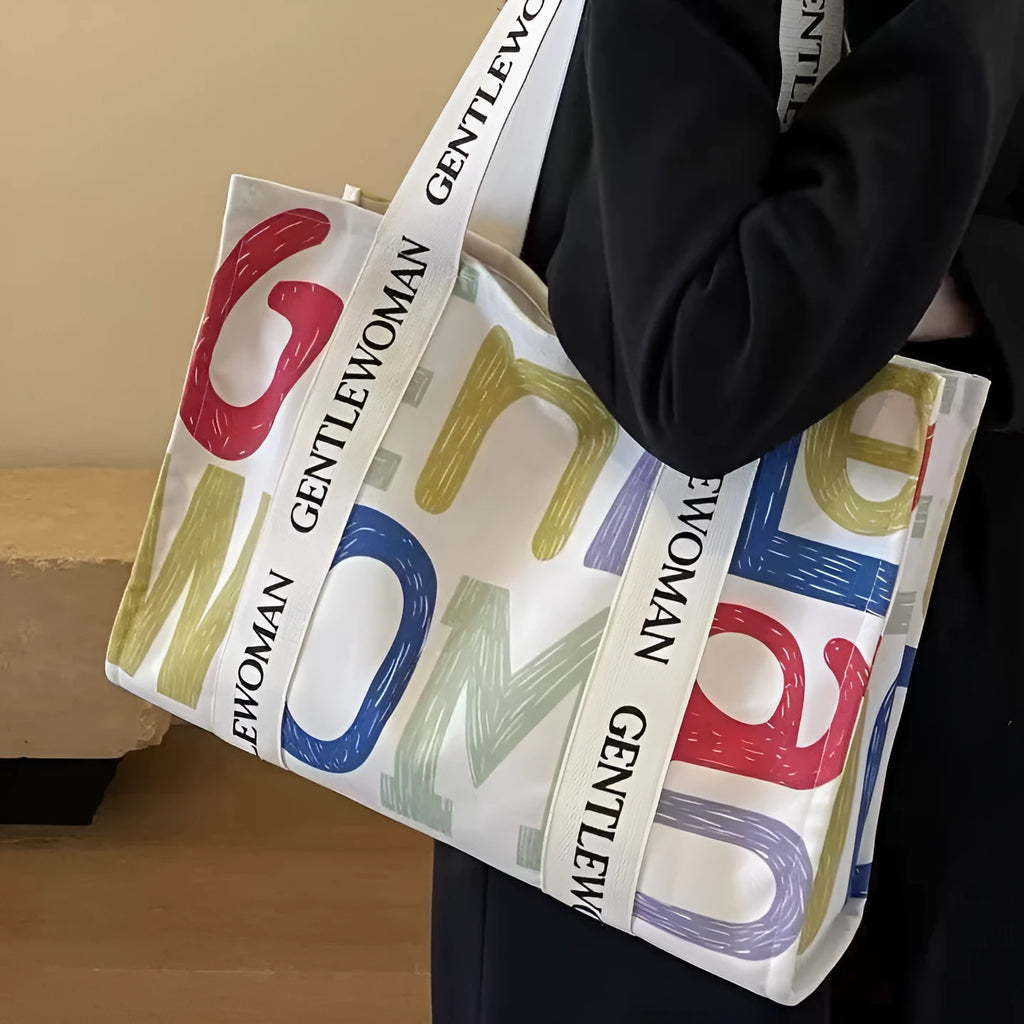 Canvas women's tote bag with printed letter or pattern designs and shoulder straps