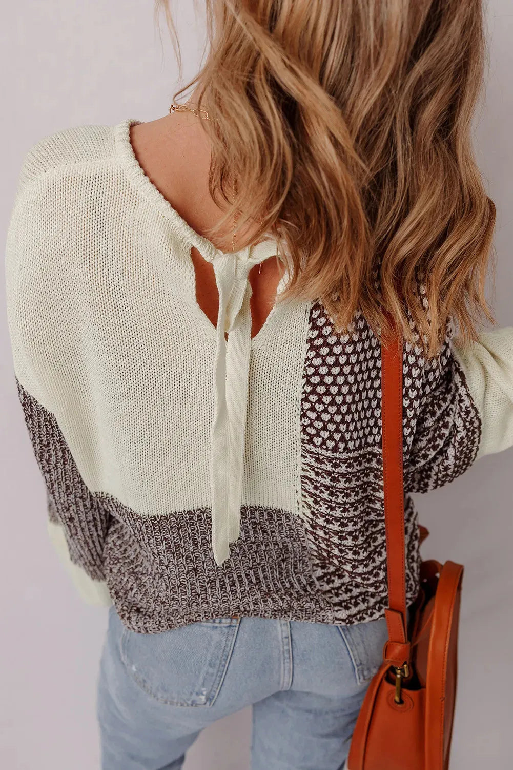 Dark khaki loose sweater with back tie detail and drop shoulder design