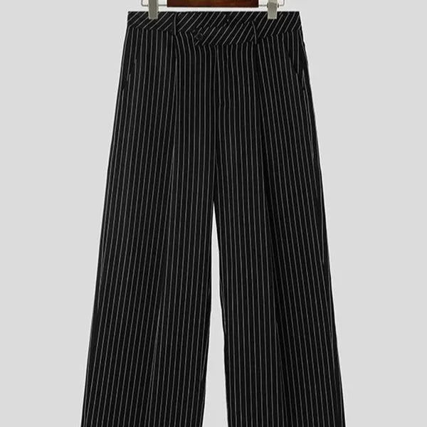 Men's black vertical striped pleated casual trousers showing elastic waistband and tapered leg
