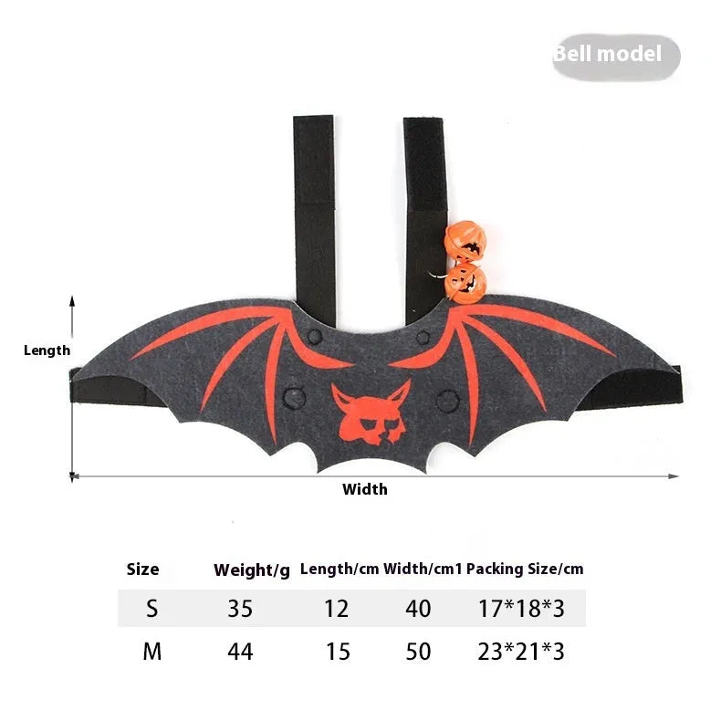 Black cat wearing an orange felt batwing Halloween costume with bell attachment.