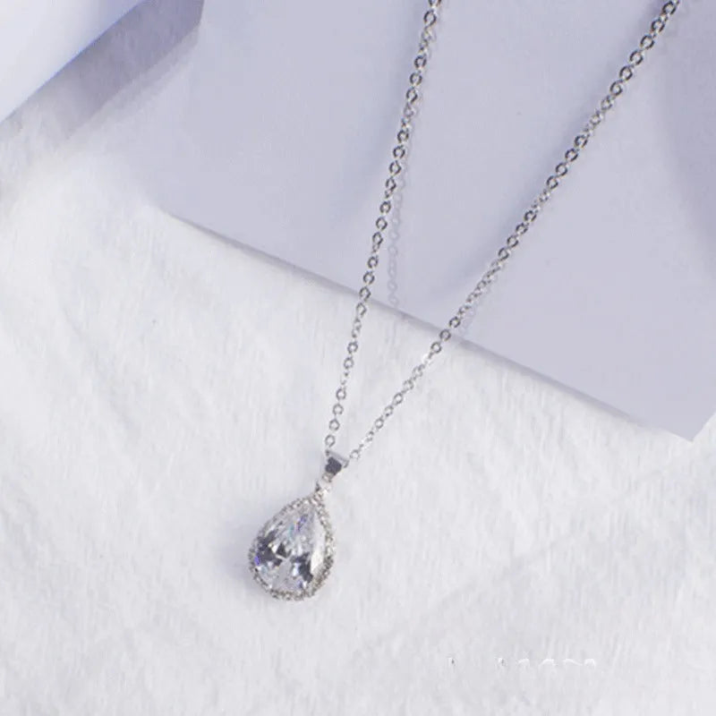 Drop shape geometric pendant necklace with rhinestone inlay in pink rose gold electroplated finish