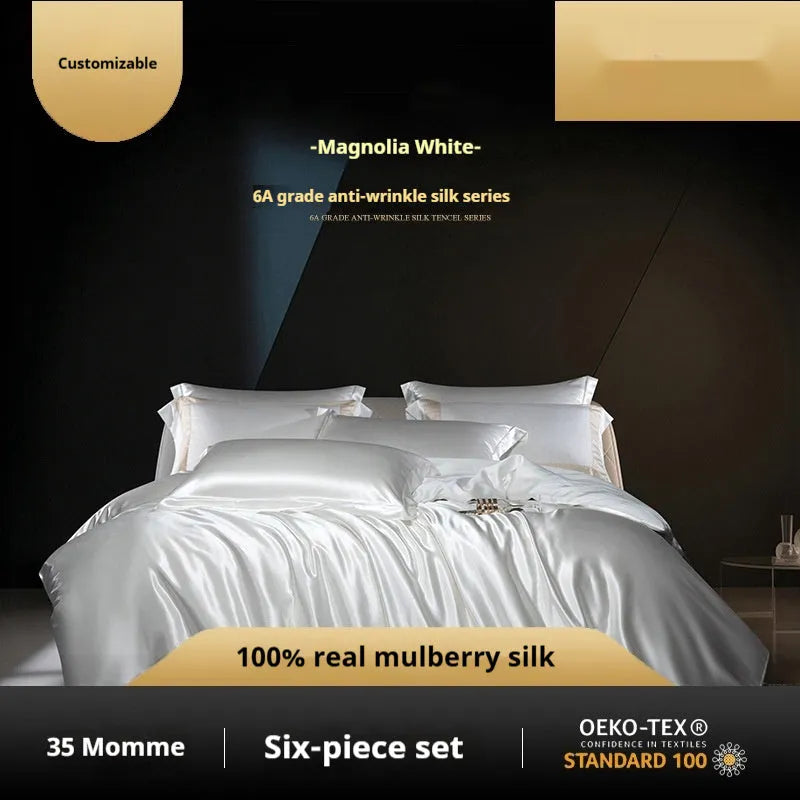 Silk four-piece quilt cover set in solid colour with fitted or flat sheet options for UK bed sizes.
