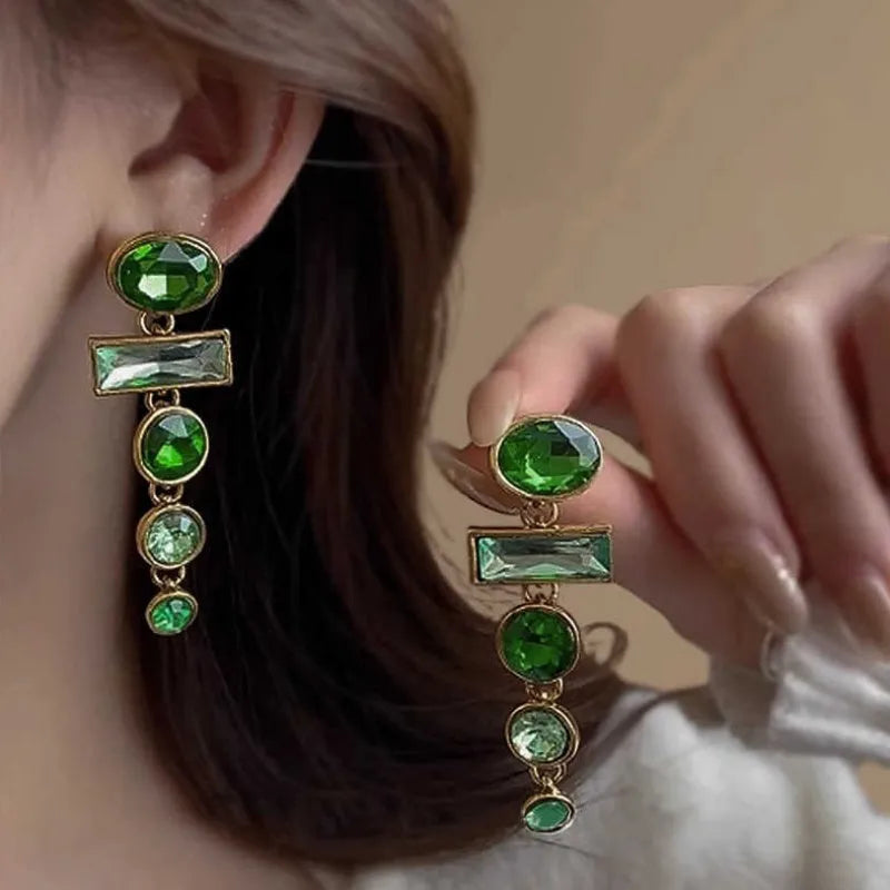 A pair of green gradient geometric alloy earrings with zircon inlay and tassel details.