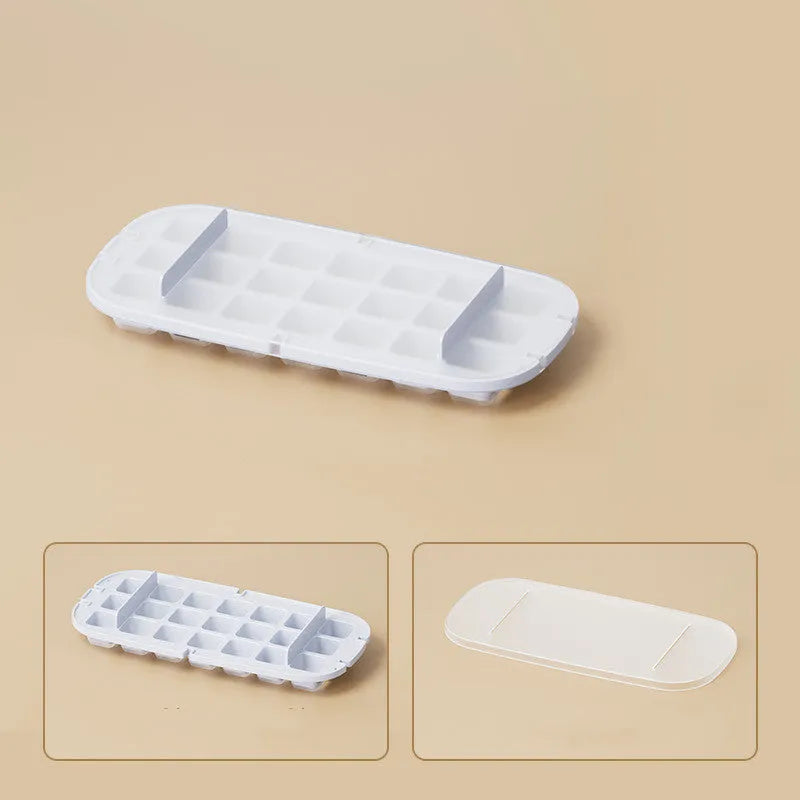 Yellow lever-operated ice cube tray grid with high capacity design and stored ice shovel.