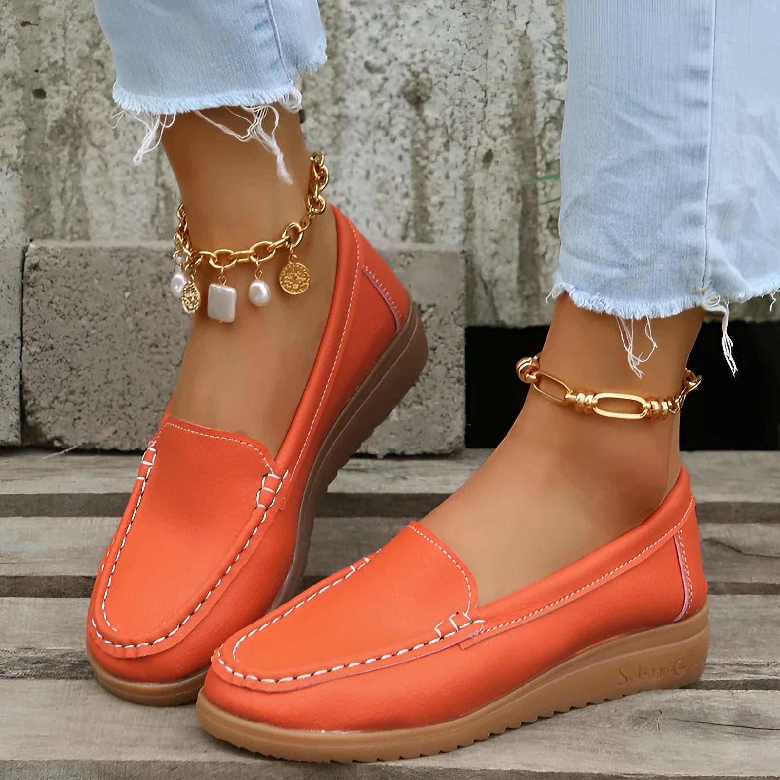Women's flat loafers in PU leather with car stitch detail and round toe, shown in multiple colours.