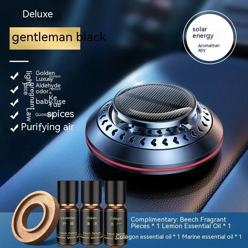 Solar-powered aluminium alloy car air freshener diffuser in black colour on a car dashboard.