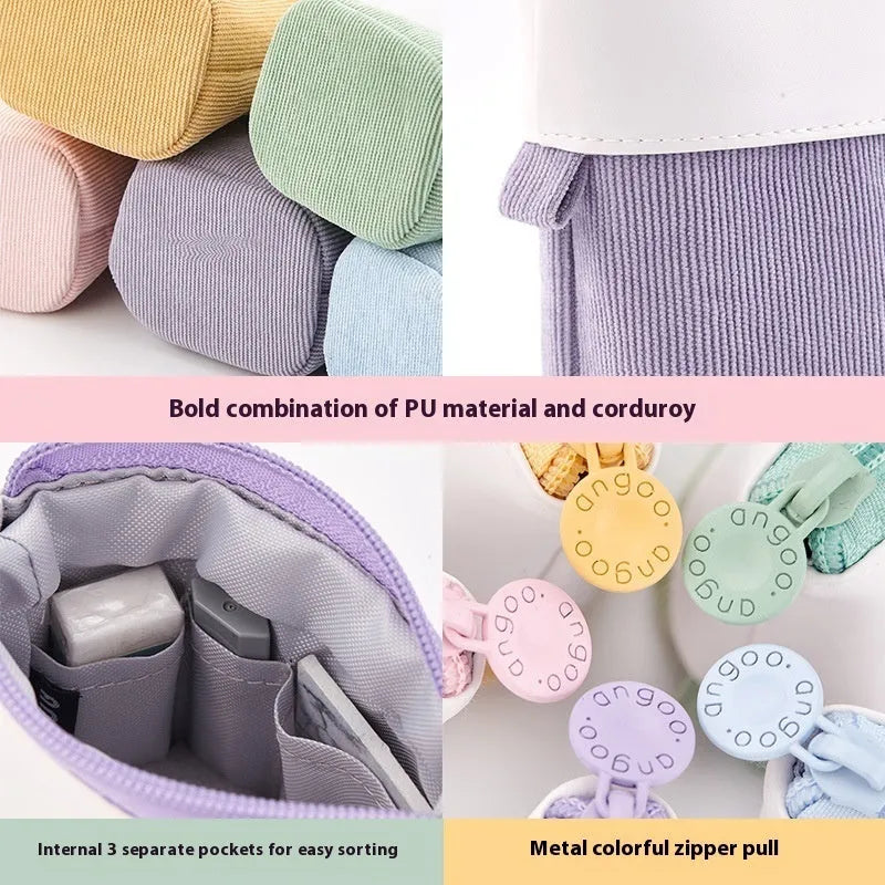Corduroy drop-down telescopic stationery case in six colour options on a desk