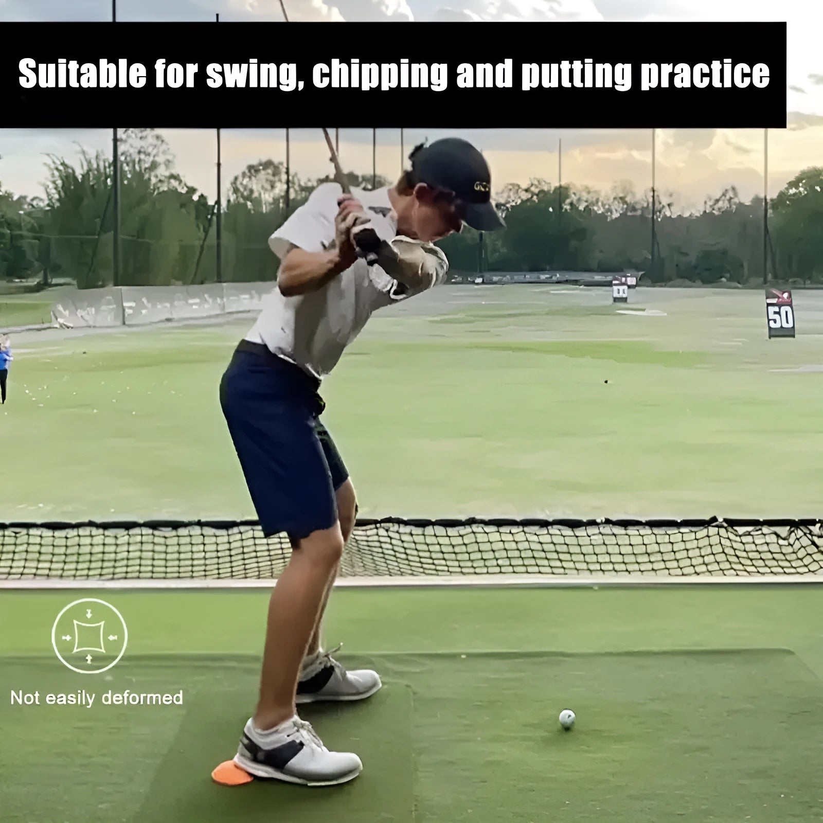 Orange-red golf training mat with weighted centre for swing practice