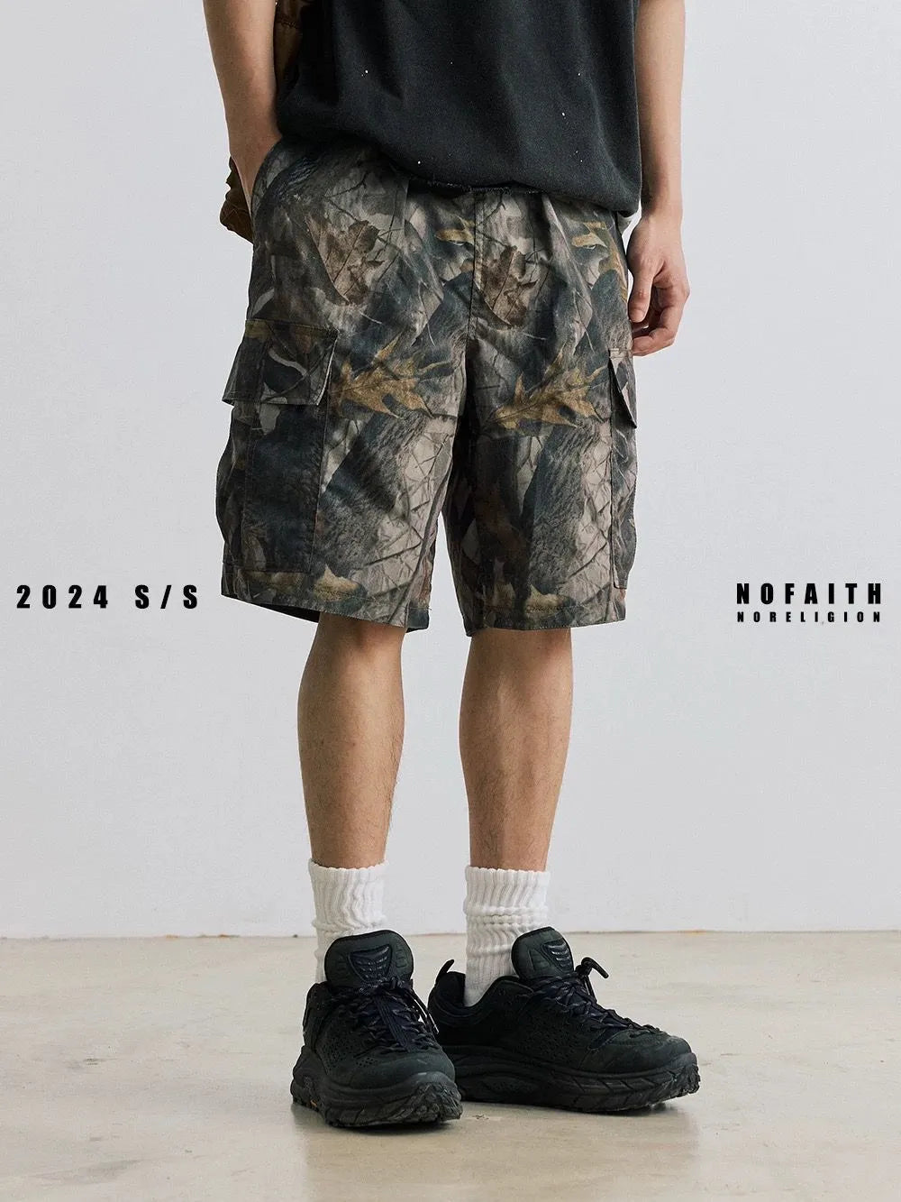 Straight-leg denim shorts in black or army green with mid-waist design and zip fly