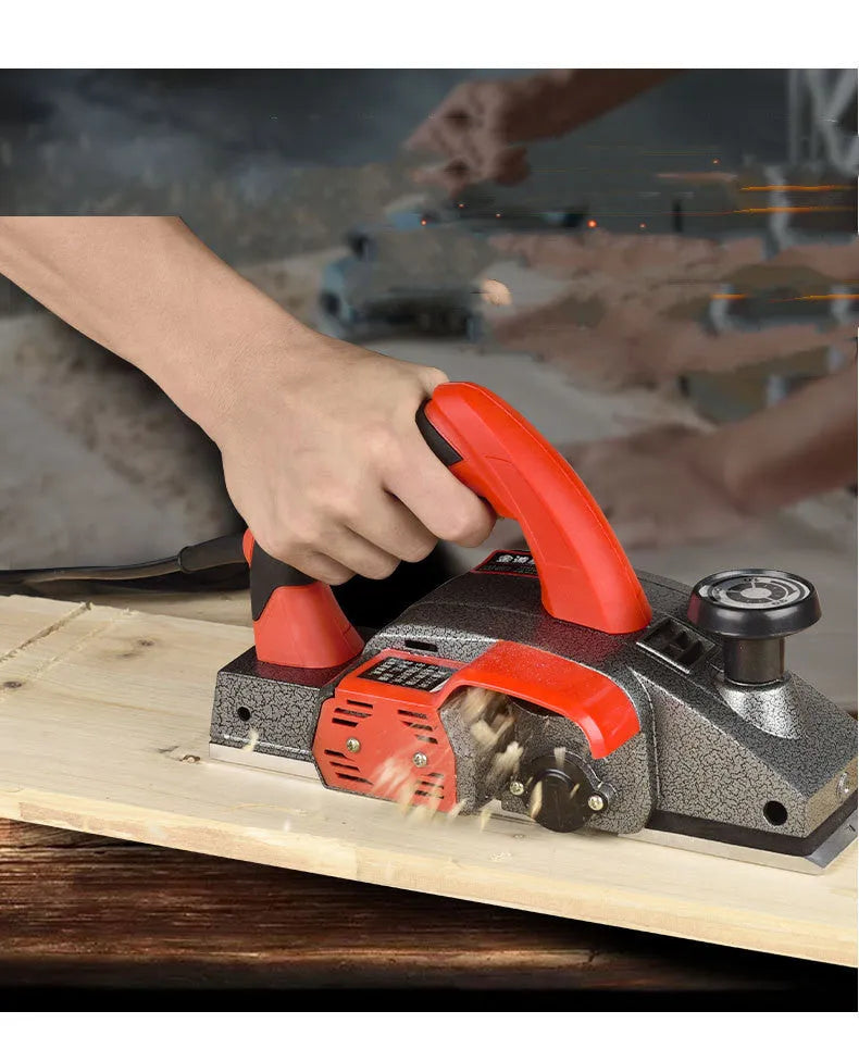 Red aluminium shell electric wood planer tool showing 82mm planing width