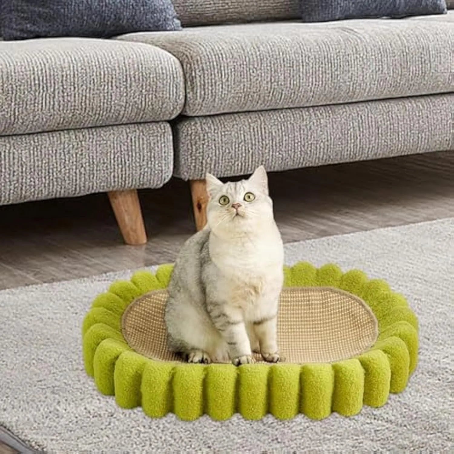 Green oval sisal cat scratcher bed measuring 650mm with scratching surface and lounging area